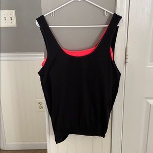 Black workout tank top with pink bra.